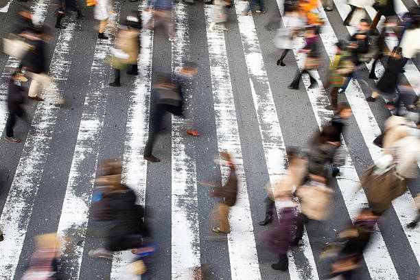 istock People walking over a pedestrian crossing 532276608