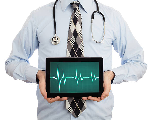 istock Doctor holding tablet - Heartbeat graph 532278574