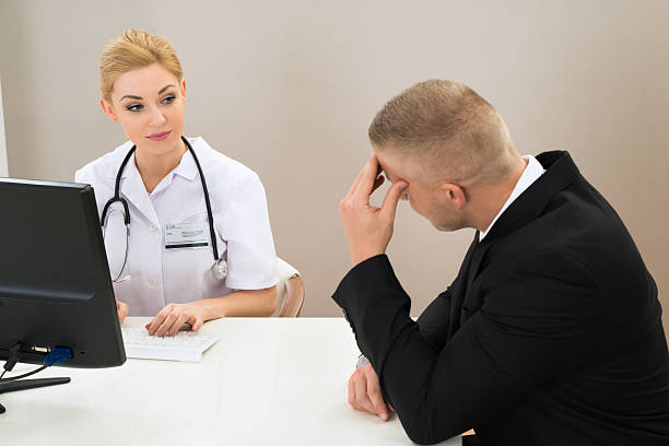 istock Female Doctor Looking At Patient 532279096
