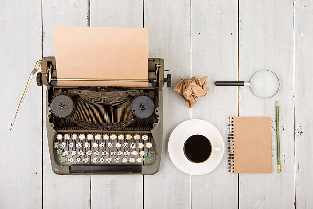 istock writer's workplace - wooden desk with typewriter 532279624