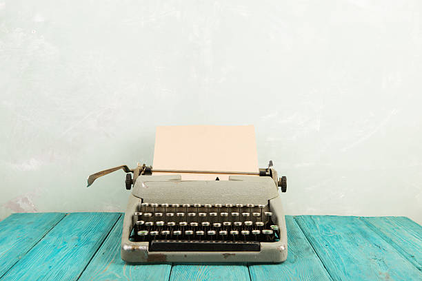 writer's workplace - wooden desk with typewriter
