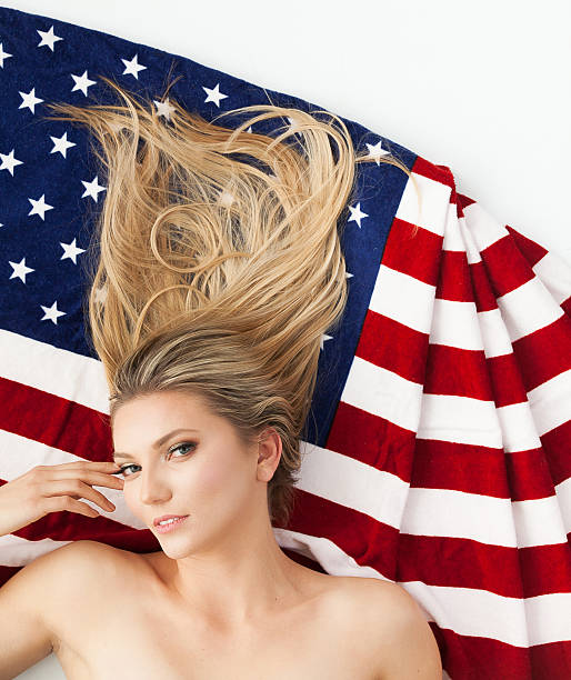 istock Beautiful woman with American flag 532279770