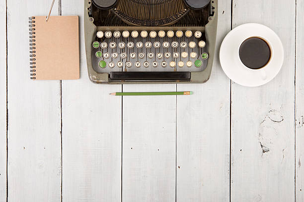 istock writer's workplace - wooden desk with typewriter 532280000