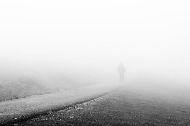 istock person walking on foggy road 532281629
