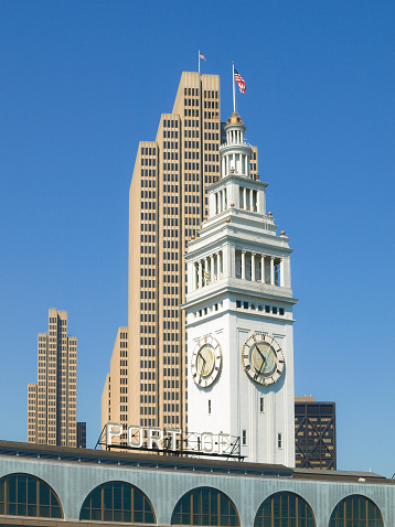 Ferry Building with white clock tower and modern skyscraper behind, San Francisco, USA