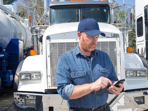 Truck Driver and Mobile Phone stock photo