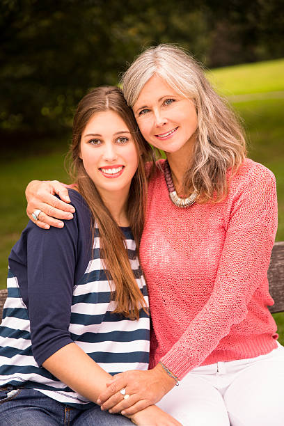 istock Mother and Daughter Sit In Park Together 532286107