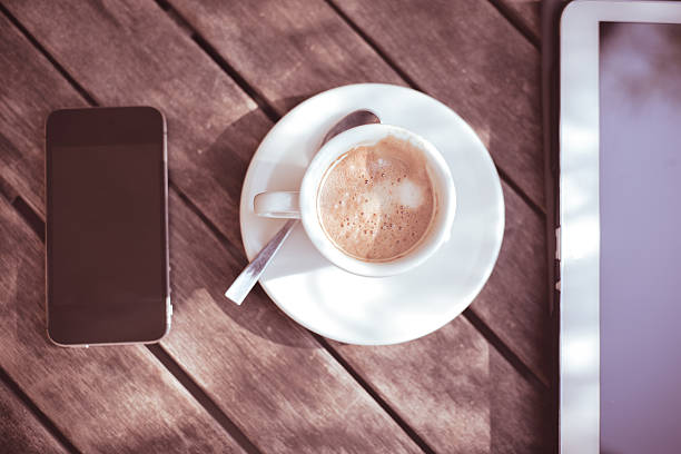 istock cup of coffe tablet and smart phone 532287587