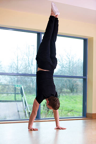 Man Doing A Hand Stand Man doing a very well executed hand stand handspring stock pictures, royalty-free photos & images