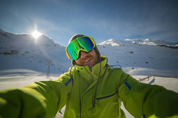 istock Young skier man taking selfie on ski slopes-Sunset time 532299079