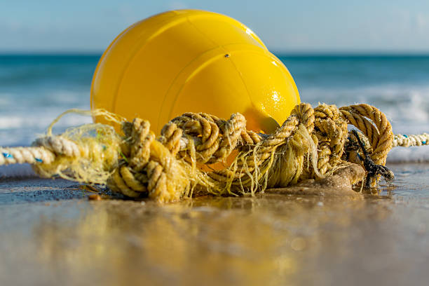 istock Yellow buoy stranded on the beach 532300047