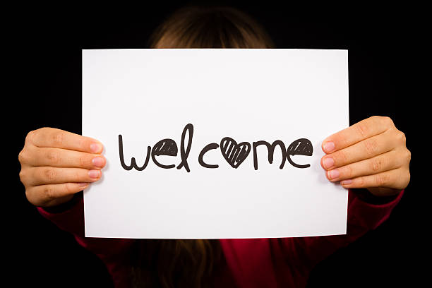 istock Child holding Welcome sign 532300091
