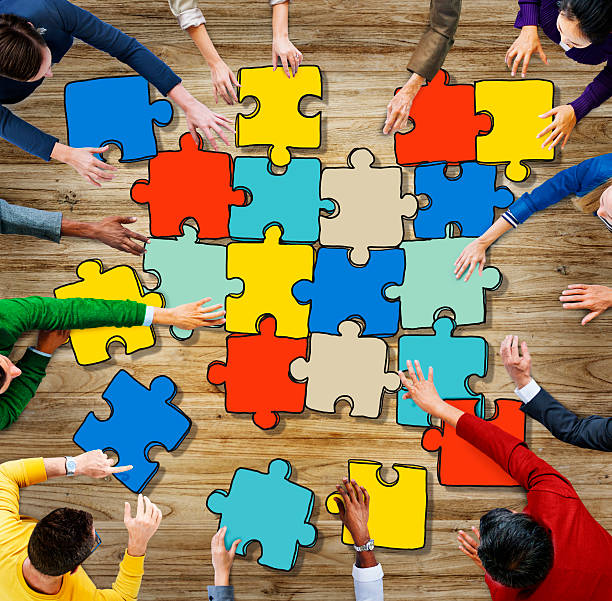 istock Group of Diverse People with Jigsaw Puzzel Pieces 532301377