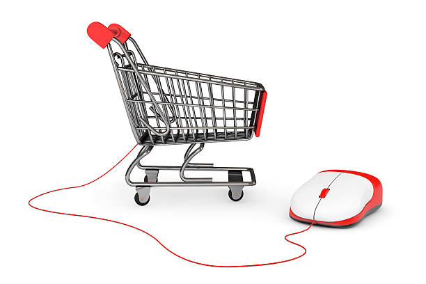 istock Online Shopping Concept. Shopping Cart connected to a Computer M 532301475