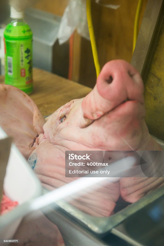 Open Market Oahu, USA - December 18, 2014: Severed pig head on display at the famous Kekaulike Market in historic Chinatown late in the day.  2015 Stock Photo
