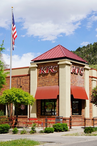 Glenwood Springs, Colorado, USA - May 21, 2014: The KFC (Kentucky Fried Chicken) location in Glenwood Springs, Colorado. Founded by Colonel Sanders, KFC is a chain of fast food restaurants specializing in chicken dishes with over 17,000 locations.