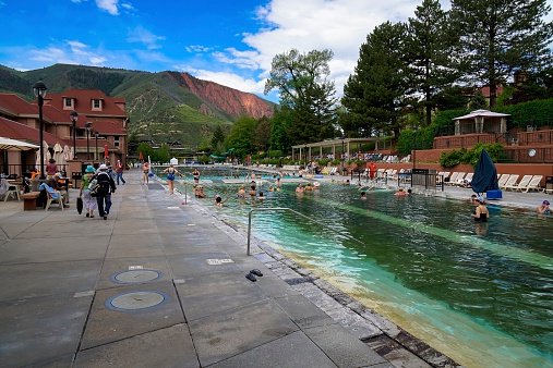 Glenwood Springs, Colorado, USA - May 21, 2014: People at one of Glenwood Springs public baths below. The area is known for its thermal springs.