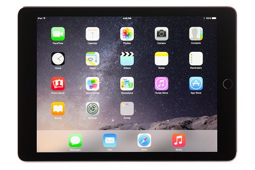 Belen, New Mexico, USA - November 1, 2014: A space gray Wi-Fi iPad Air 2 with iOS 8.1 by Apple Inc. Announced on October 16, 2014, the iPad Air 2 is now just 6.1 mm thin and weighs less than a pound, It also features an improved Retina display, improved cameras, and Touch ID.