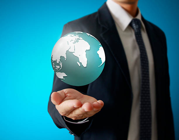 istock holding a glowing earth globe in his hands 532315205