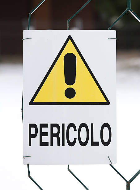 yellow caution sign with writing in Italian big yellow caution sign with writing in Italian impassable limit stock pictures, royalty-free photos & images