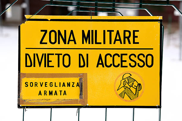 military zone sign off from a military italian base attention military zone sign off from a military base in europe impassable limit stock pictures, royalty-free photos & images
