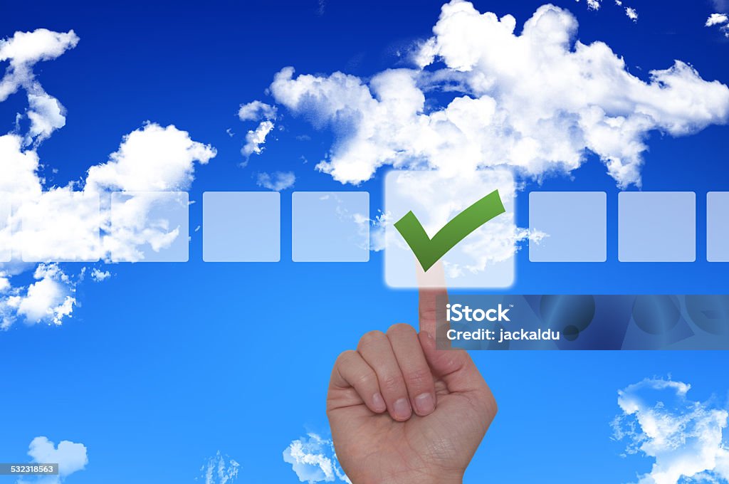 Female Hand Touching Button and Ticking Check Box Young female hand touching, pressing modern button and ticking check box out of empty boxes on digital screen interface on virtual background. 2015 Stock Photo