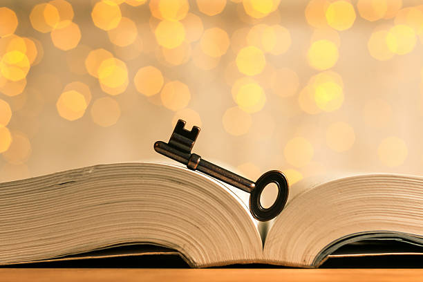 key and book with flares background