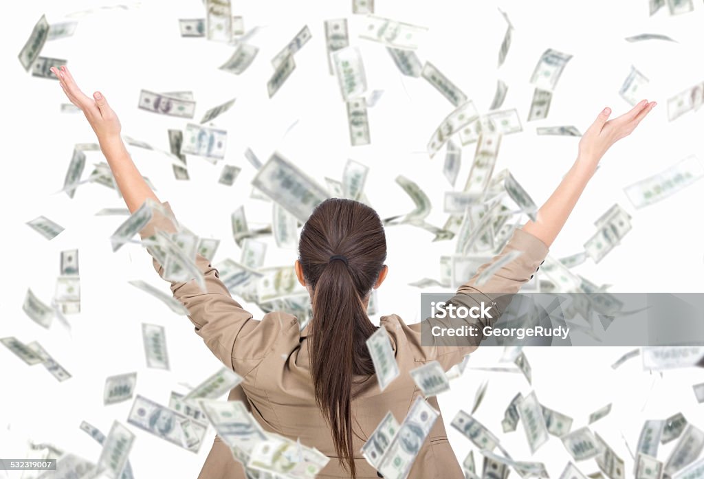 Money Young business woman and money banknotes flying in air on the white background. Currency Stock Photo