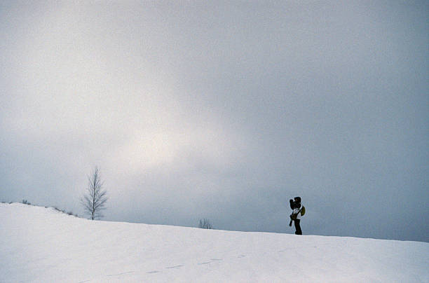 istock Photographer in winter mountains. 532319597