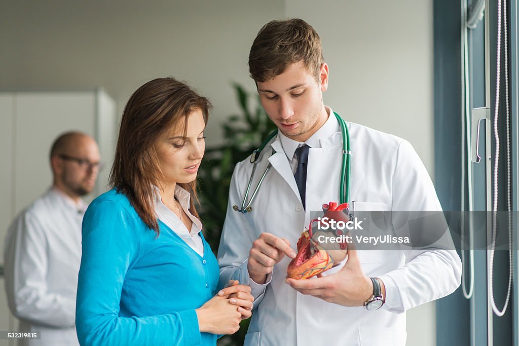 doctorconsult patient with heart problems doctor consult patient with heart problems Cardiologist Stock Photo