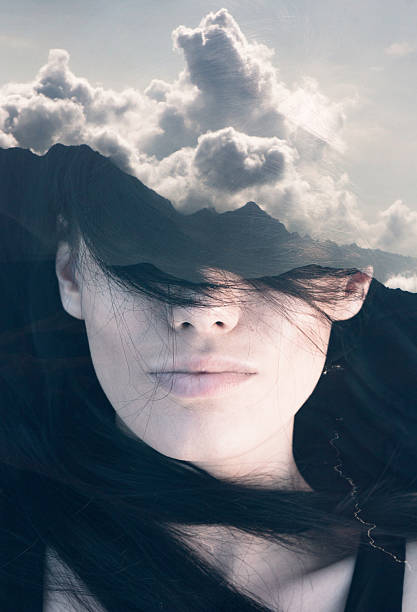 Double exposure portrait Double exposure portrait of young woman combined with photograph of mountainious landscape shot from a plane symmetry photos stock pictures, royalty-free photos & images