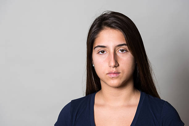 Serious Hispanic girl Serious Hispanic girl looking at the camera mediterranean woman portrait stock pictures, royalty-free photos & images