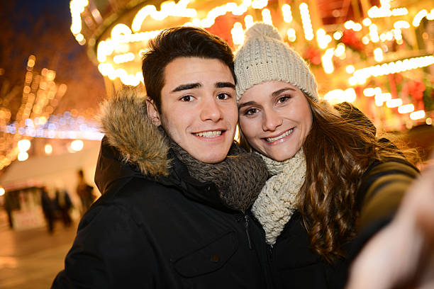 istock lovely young couple having fun downtown at night during winter 532323115