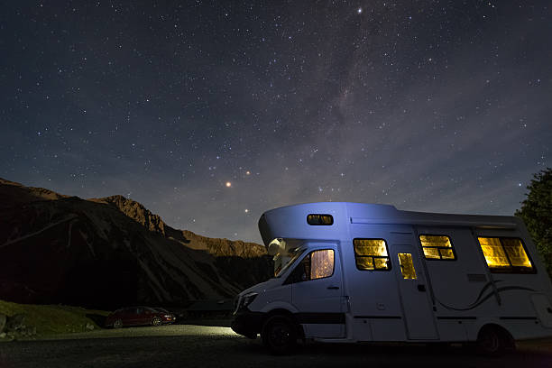 campervan with milky way at night campervan at White Horse campground with night sky background mt cook photos stock pictures, royalty-free photos & images