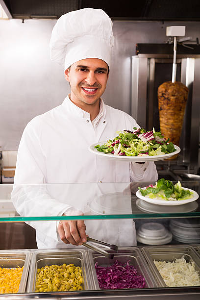istock Happy male chef with vegetables 532330102