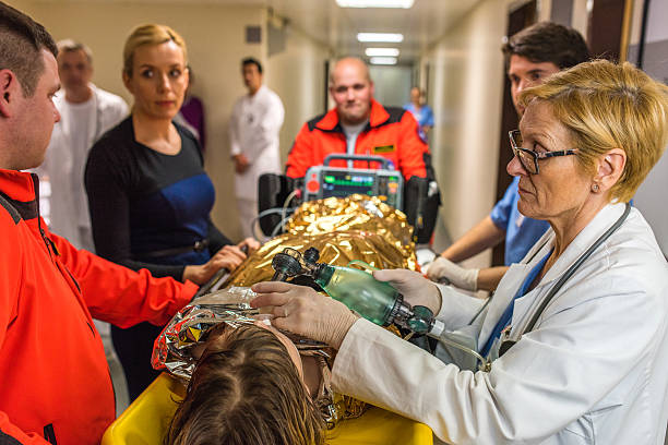 istock Doctors and patient in hospital's corridor 532330622