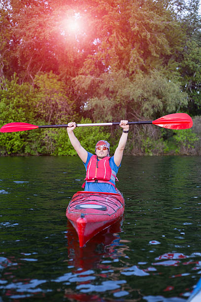 istock Man paddling in a red kayak in Florida 532331414