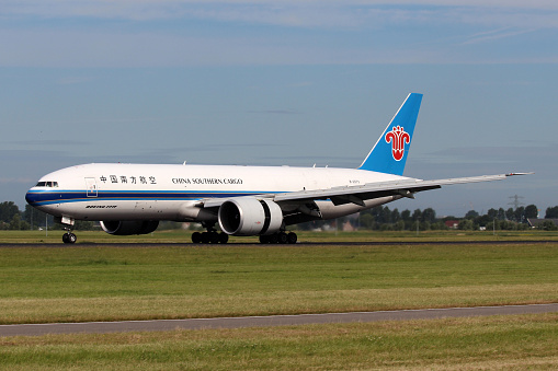 Amsterdam, Netherlands - July 2, 2012: China Southern Airlines Cargo Boeing 777-F1B lands at AMS Airport in Netherlands.