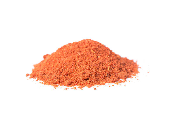 istock Dried red peppers and flakes  on white. 532332211