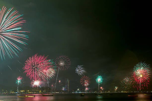 istock beautiful fireworks celebrating new year on patong beach thailan 532332231