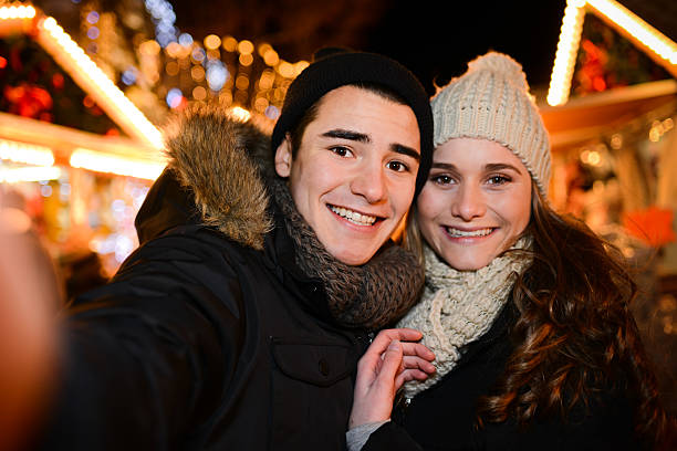 istock lovely young couple having fun downtown at night during winter 532332237