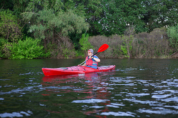 istock Man paddling in a red kayak in Florida 532332270