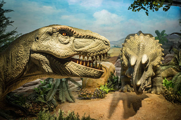 Dinosaurs and a meteor falling from the sky in back background.