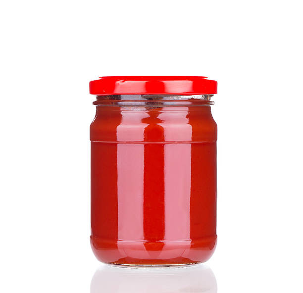 istock Glass jar full of tomato sauce. 532333302