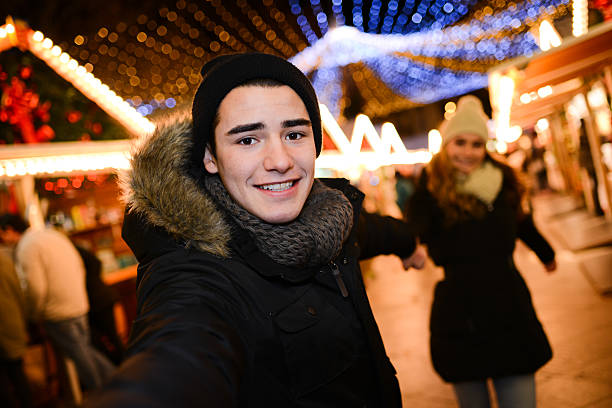 istock lovely young couple having fun downtown at night during winter 532333751