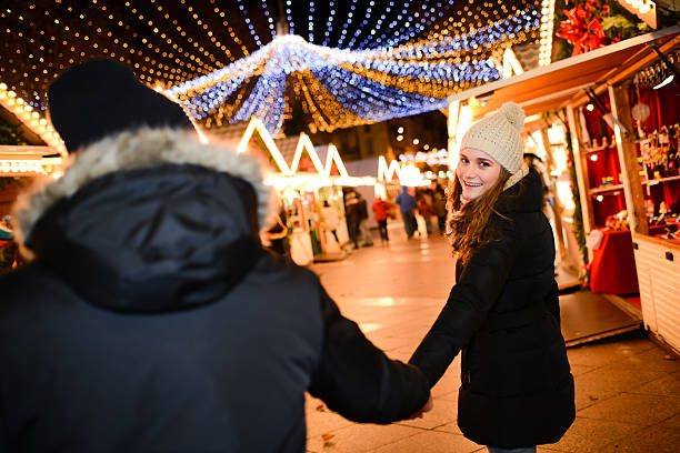 istock lovely young couple having fun downtown at night during winter 532333785