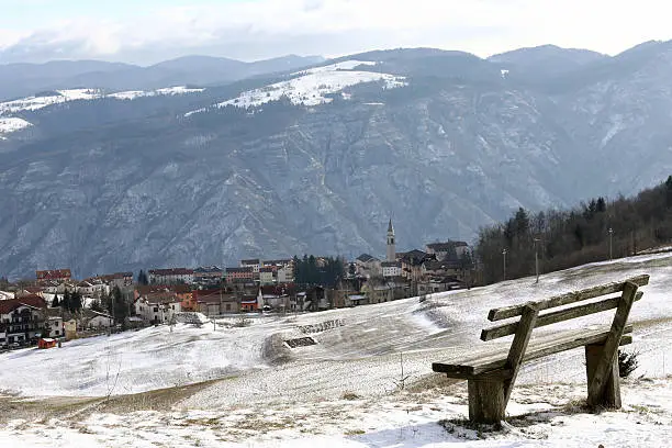 Photo of mountain town of Tonezza and a bench