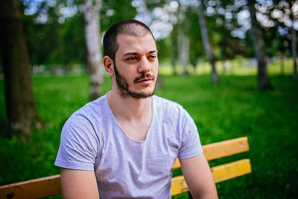 istock Man sitting in the park 532334864
