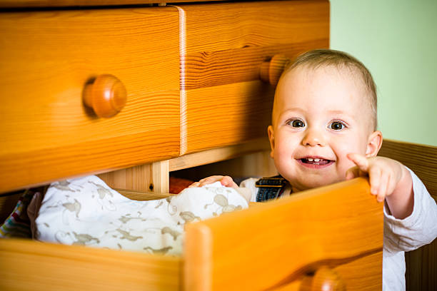 istock Domestic chores - baby opens drawer 532335107