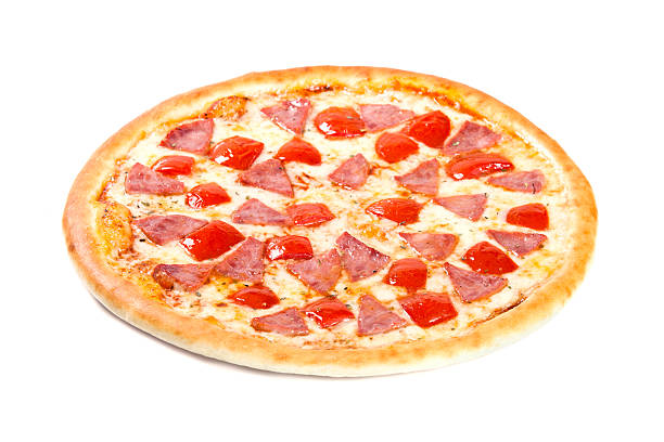 istock Pizza with ham and tomato isolated on white background 532335950